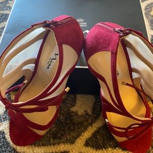 New, never worn, suede peep toe, back zip, faux ankle tie stiletto.